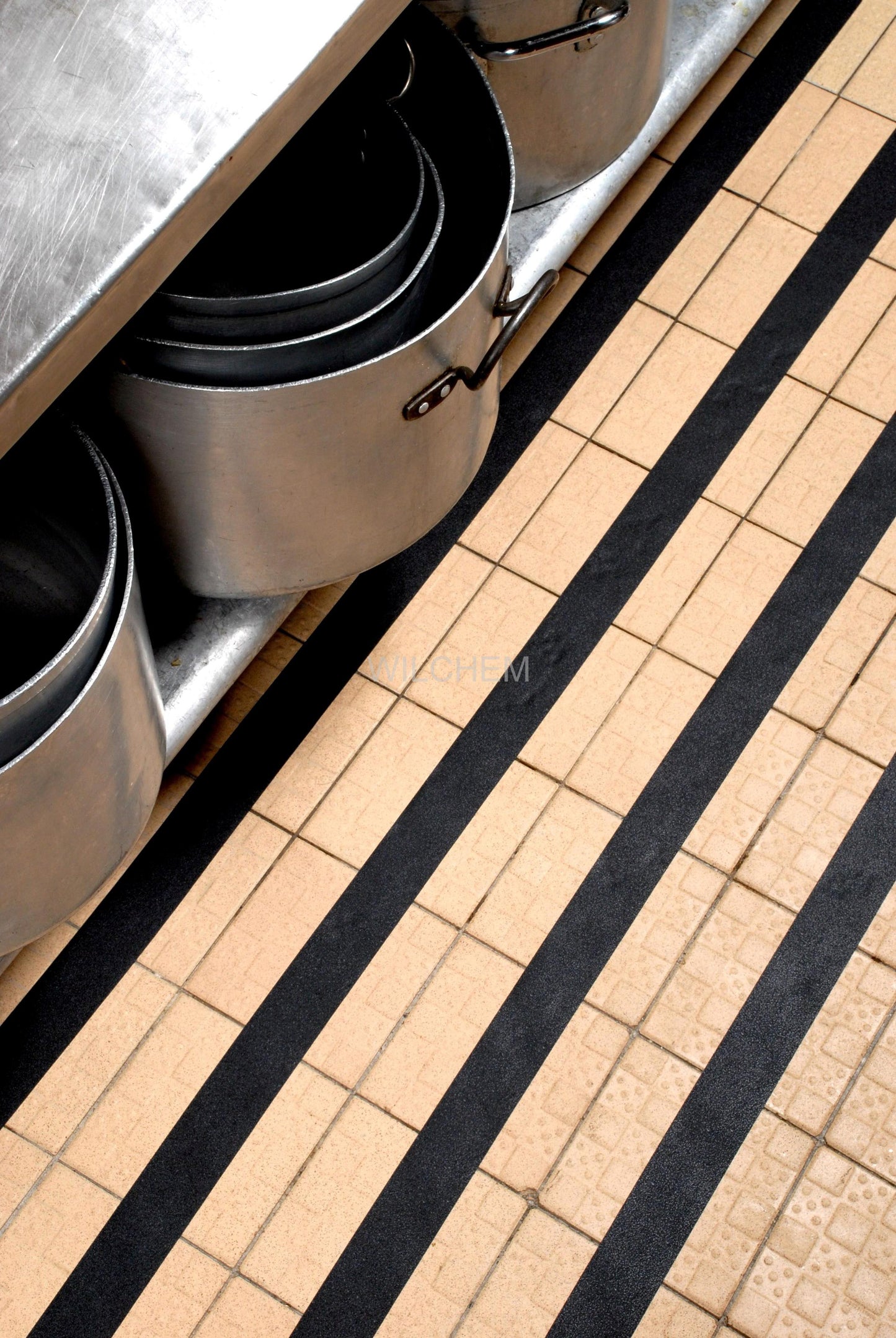 HESKINS RESILIENT NON-ABRASIVE ANTI-SLIP TAPE. This material is waterproof, and our adhesive will not break down in water easily. It is for showers, Boats, Stairs, Kitchens, Swimming Pools, and other marine applications.