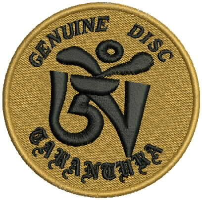 Round patch with 'Genuine Disc Warner' logo on a gold background